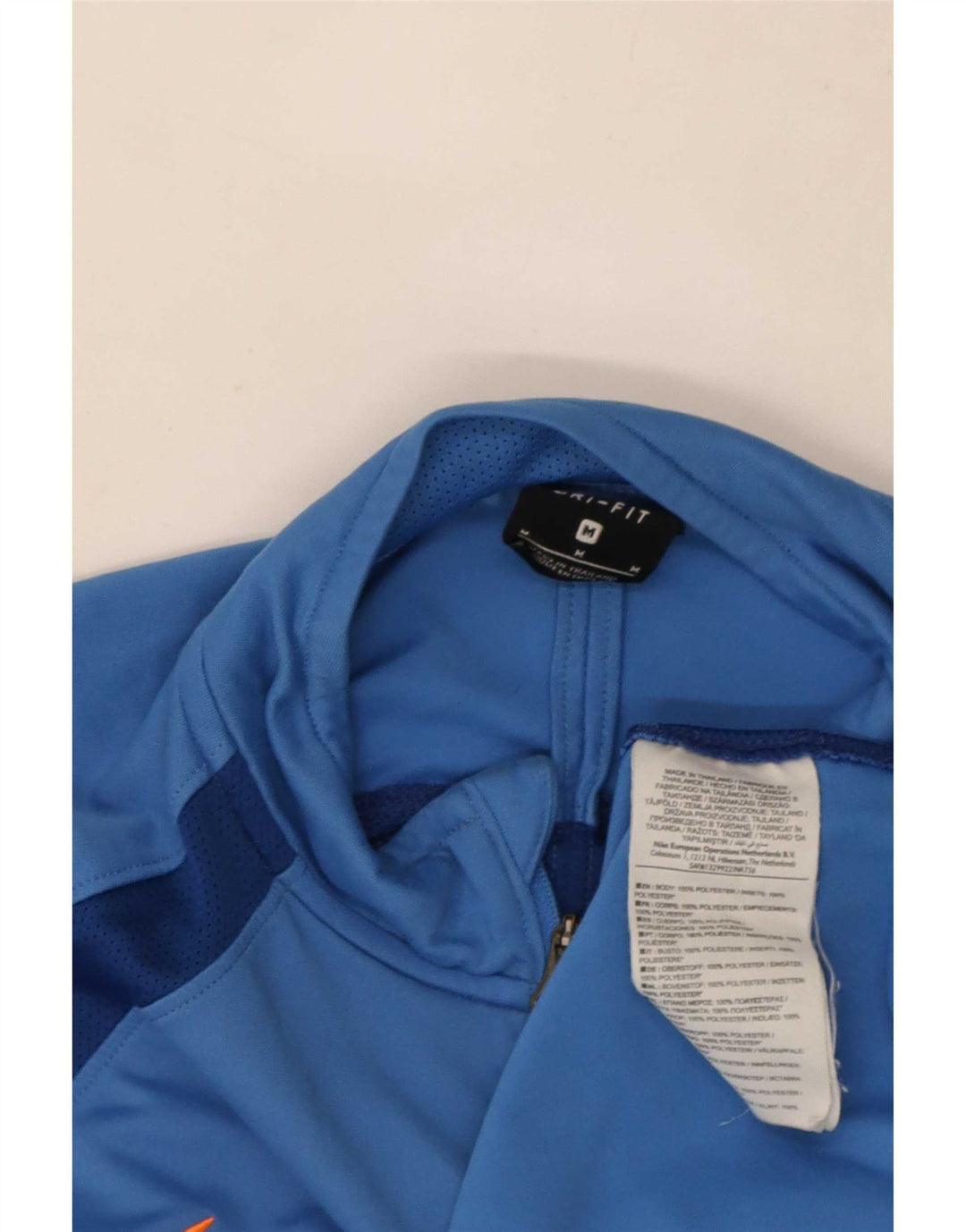 Nike Dri Fit majica s izrezom i gornjim dijelom trenirke srednje plave boje