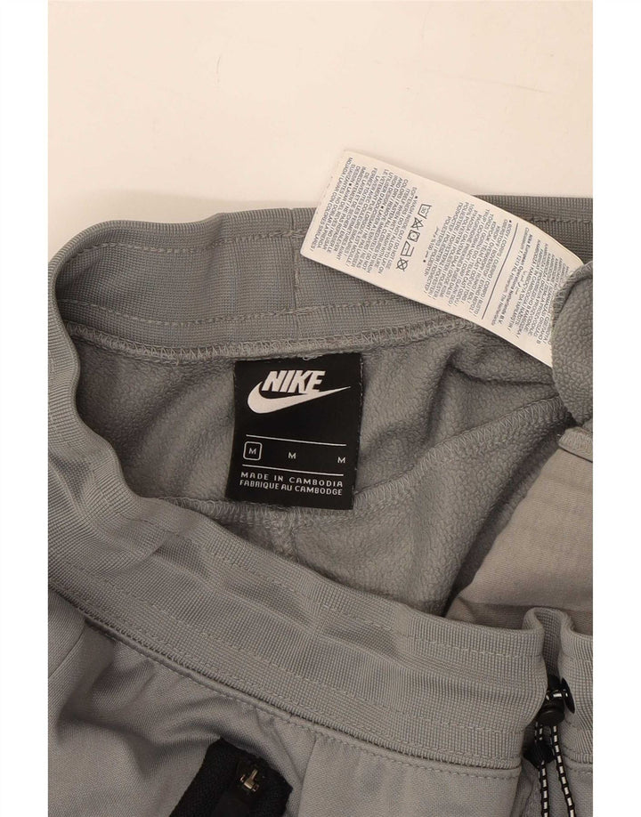 Nike muške trenirke Hlače Joggers srednje sivi poliester u boji